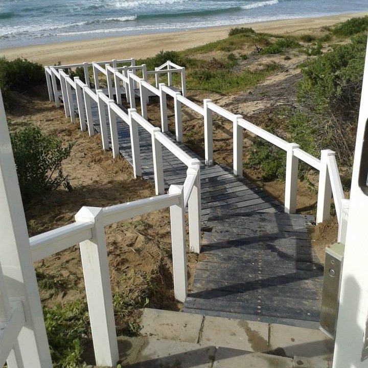 Single PVC handrail installed on a staircase